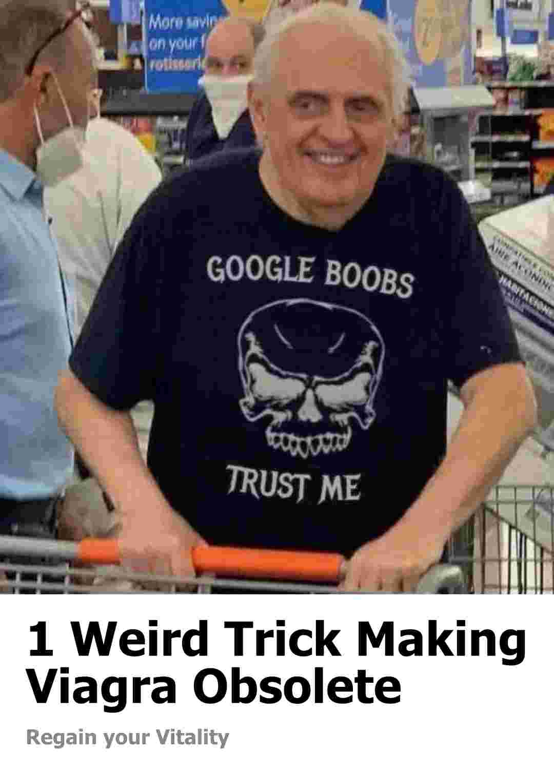 Old man casually smiling in line at a Walmart check out wearing a shirt that reads 'GOOGLE BOOBS TRUST ME'